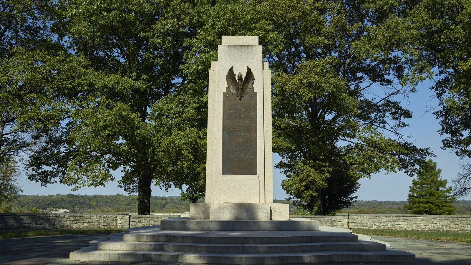 Image of a concrete column with a Bronze plaque in honor of the Wright Brothers.