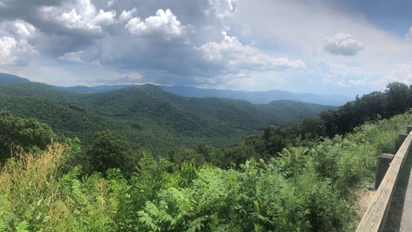 Green layered mountains stretch for miles