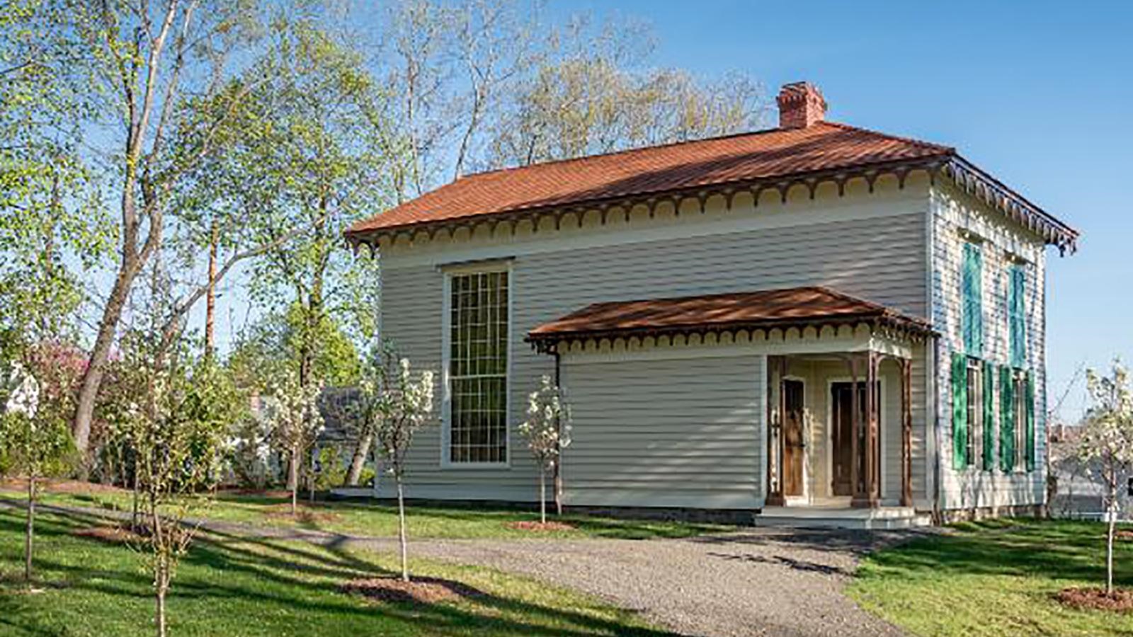 A two-story rectangular clapboard-sided building.