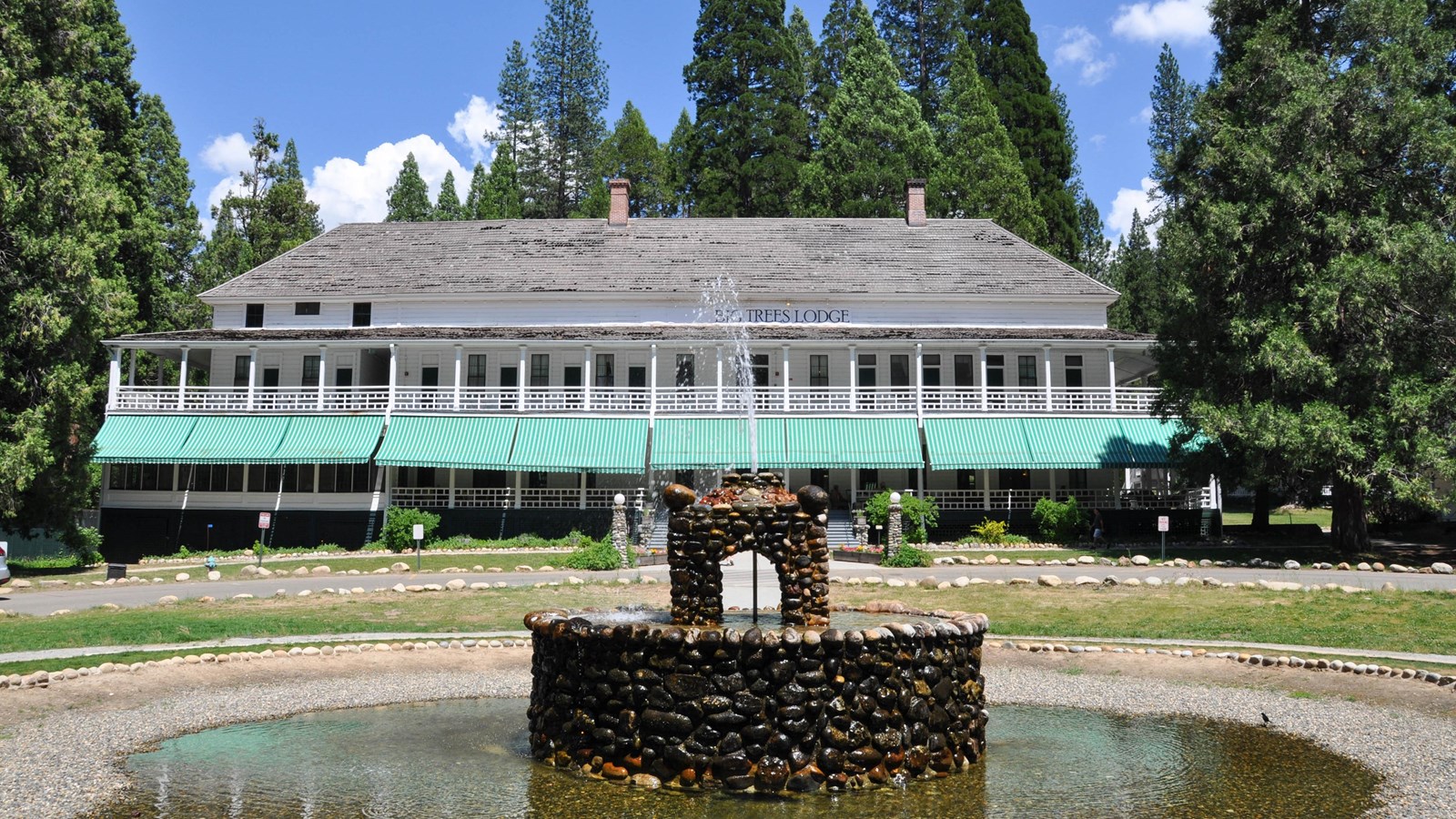 Image of fountain in foreground and hotel in background