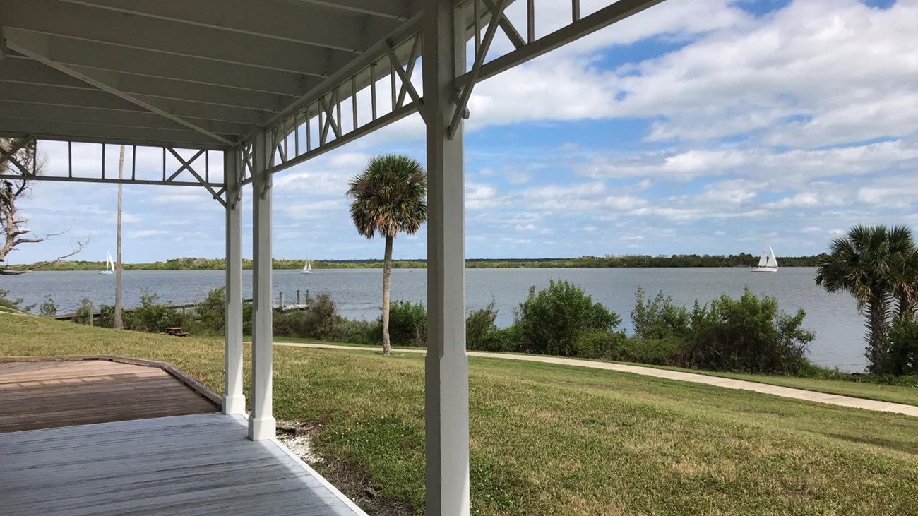 Seminole Rest porch with the lagoon in the background.