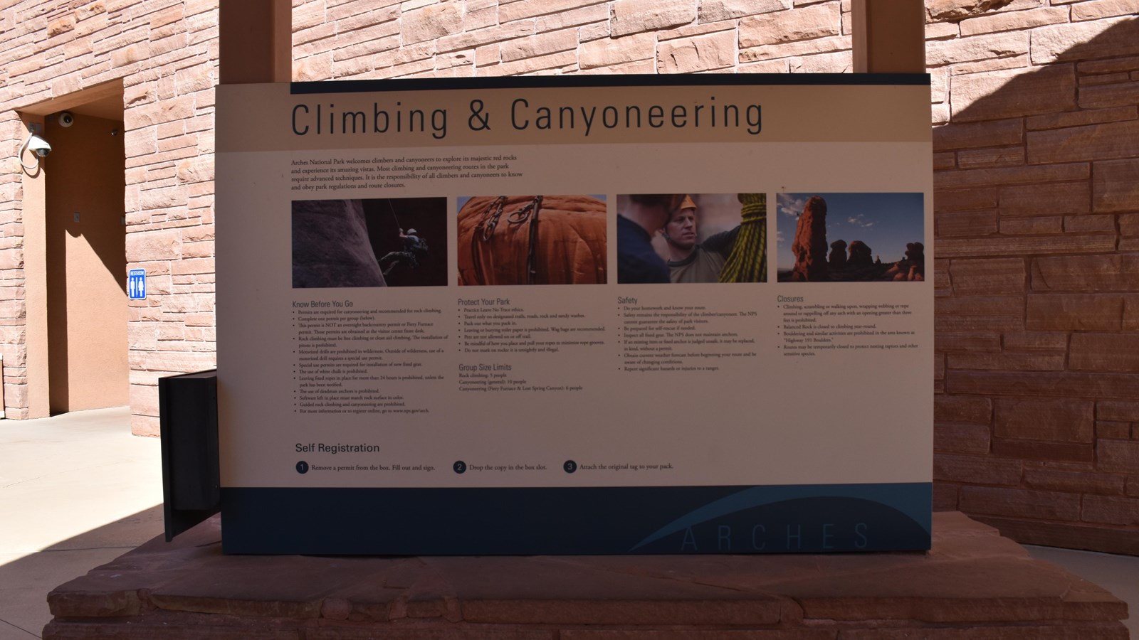 Panel that informs visitors of the rules for climbing and canyoneering in the park,