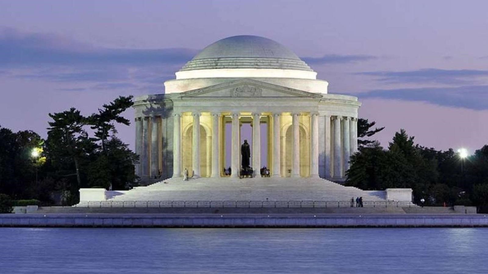 Domed memorial with columns on waterfront.