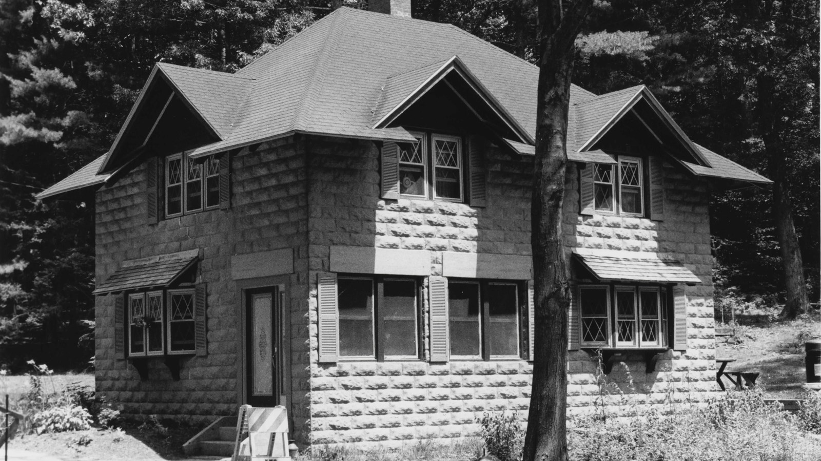 Two-story concrete building with chimney