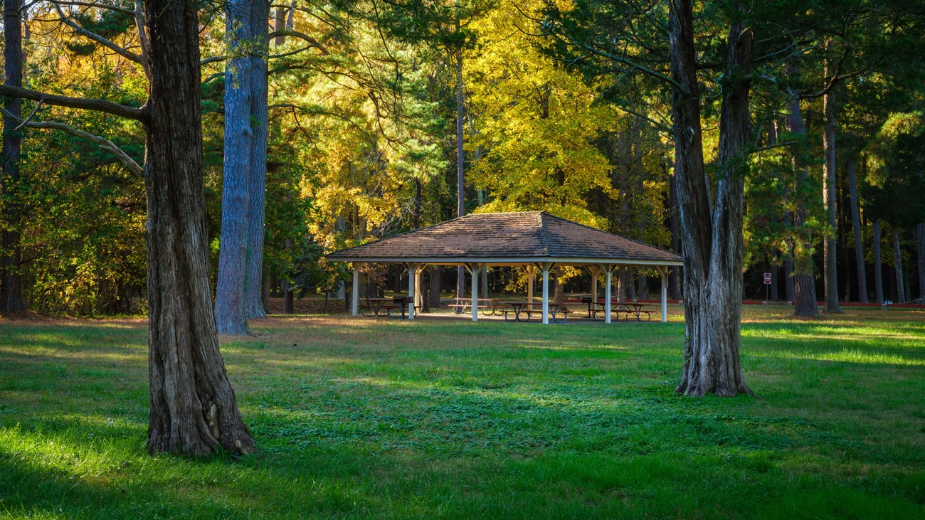 an overhang with picnic tables underneath.