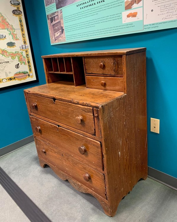 A pine Federal style desk with three drawers.