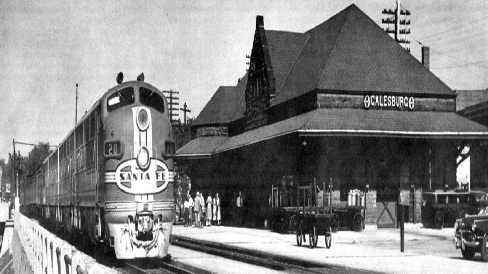 A colorized postcard of Galesburg Illinois train station and the Sante Fe Train.