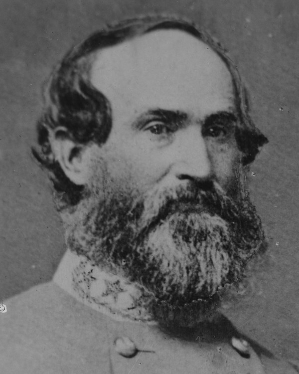 An 1860s bust portrait photo shows a bearded man seated in double-breasted army uniform.