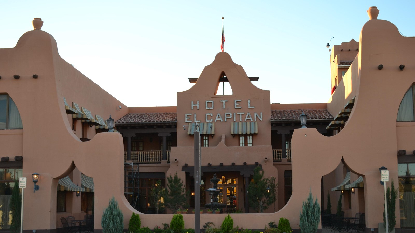 A multi-story adobe hotel building