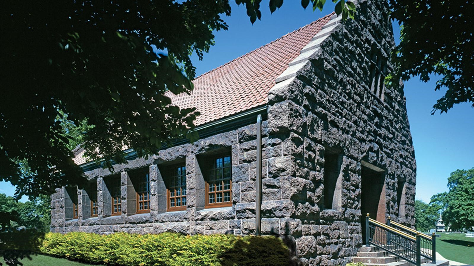 A grey stone, one story chapel.