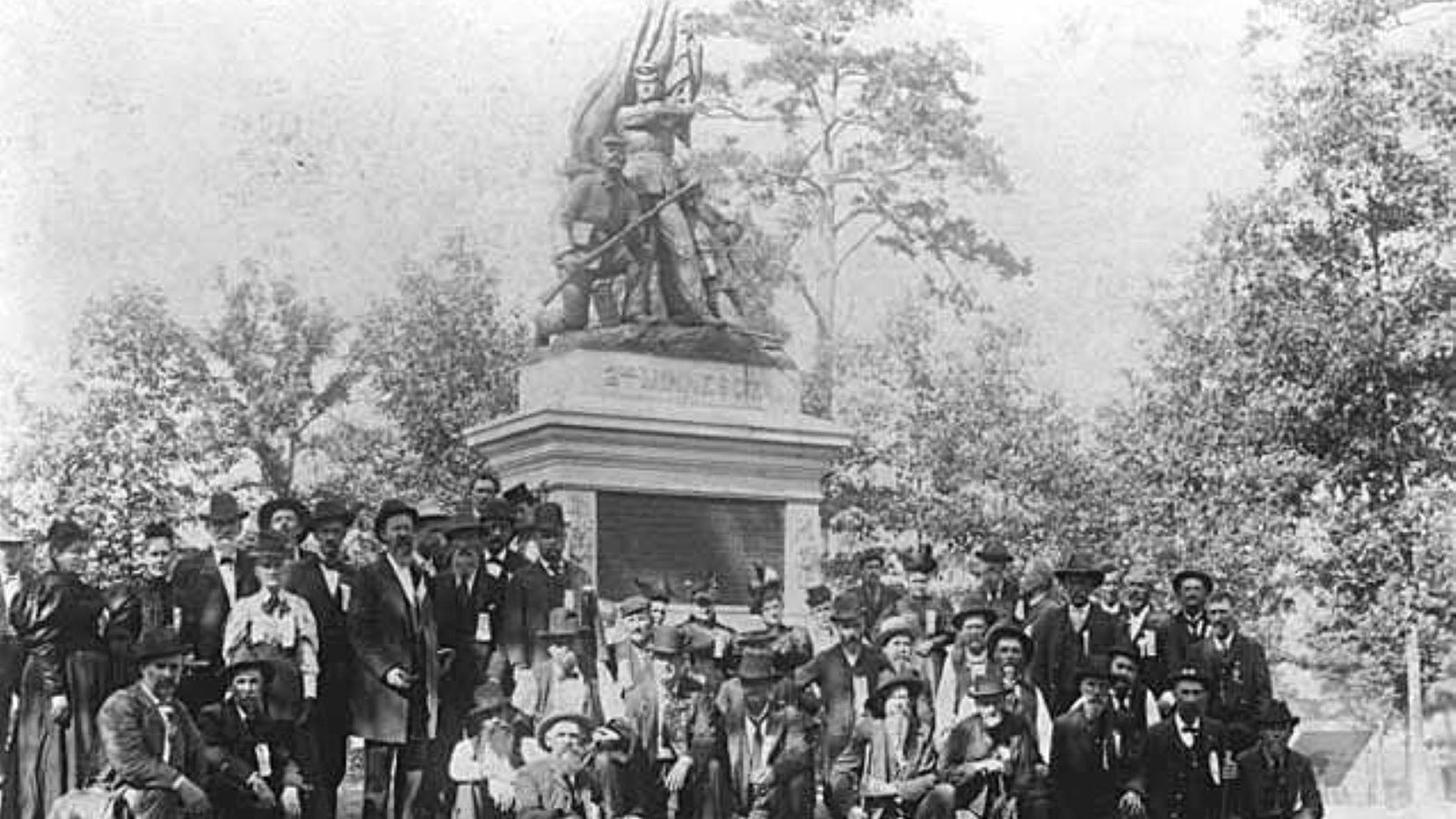Veterans of the 2nd Minnesota Infantry gather around their monument on Horseshoe Ridge.