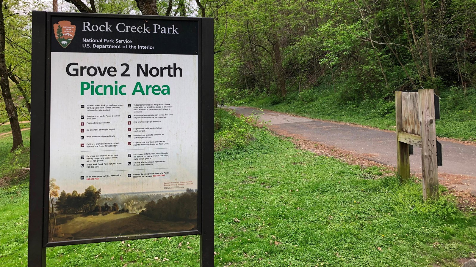 A white sign with black and green text