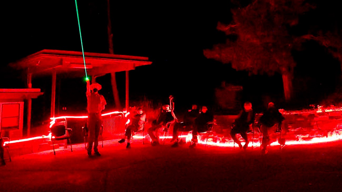 Red lit ranger program with ranger using green laser pointer.