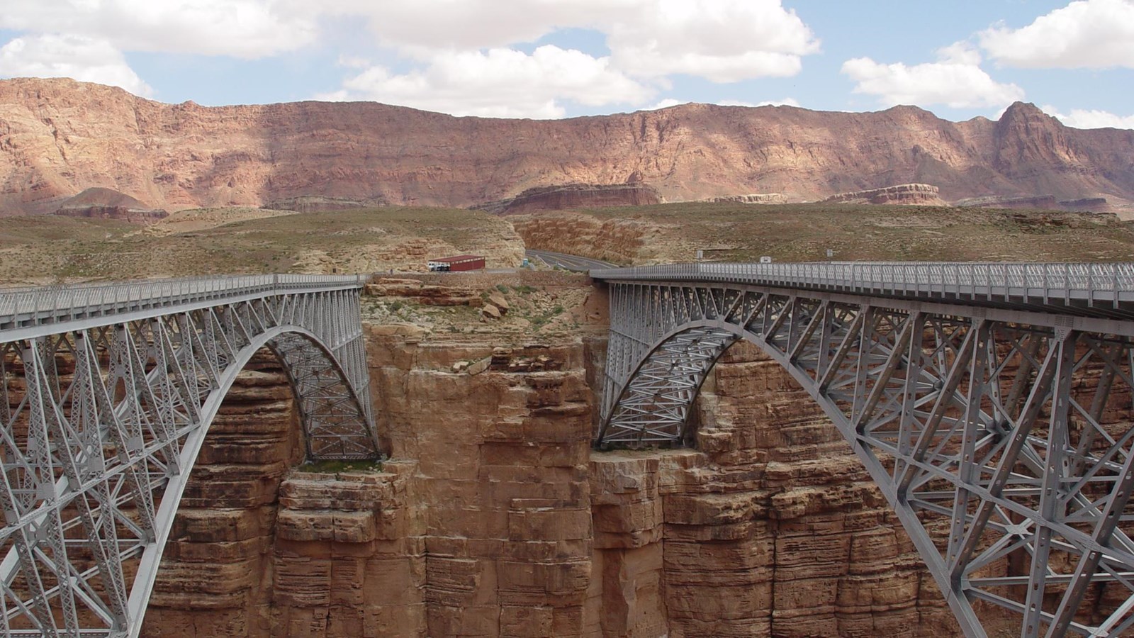 two steel-arch bridges across a canyon