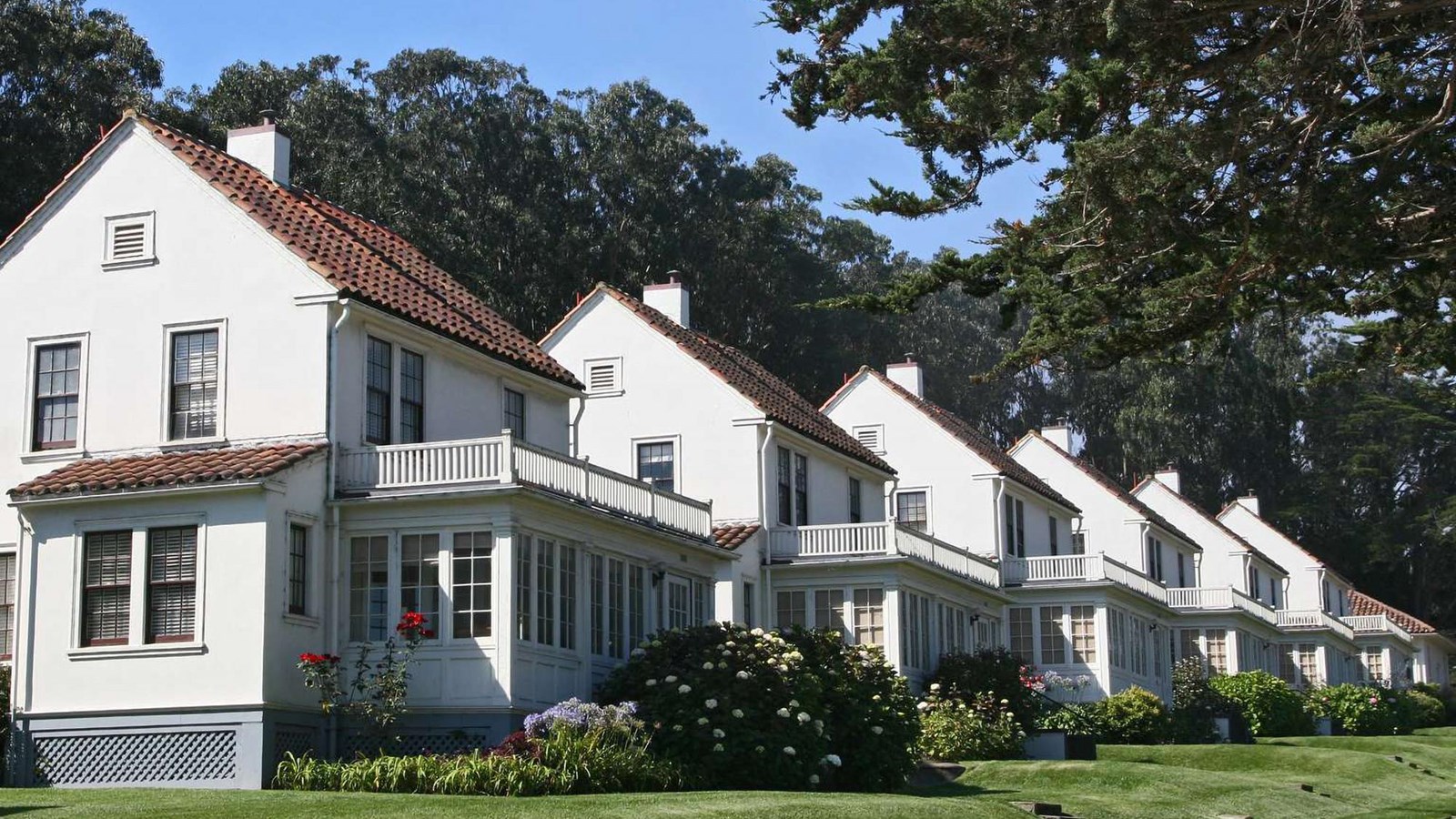 The residences at Pilots\' Row seen at an angle with the identical houses with their porches.