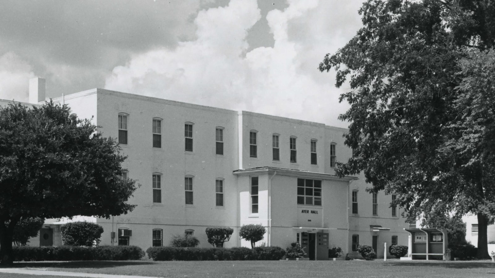 Three story white building with