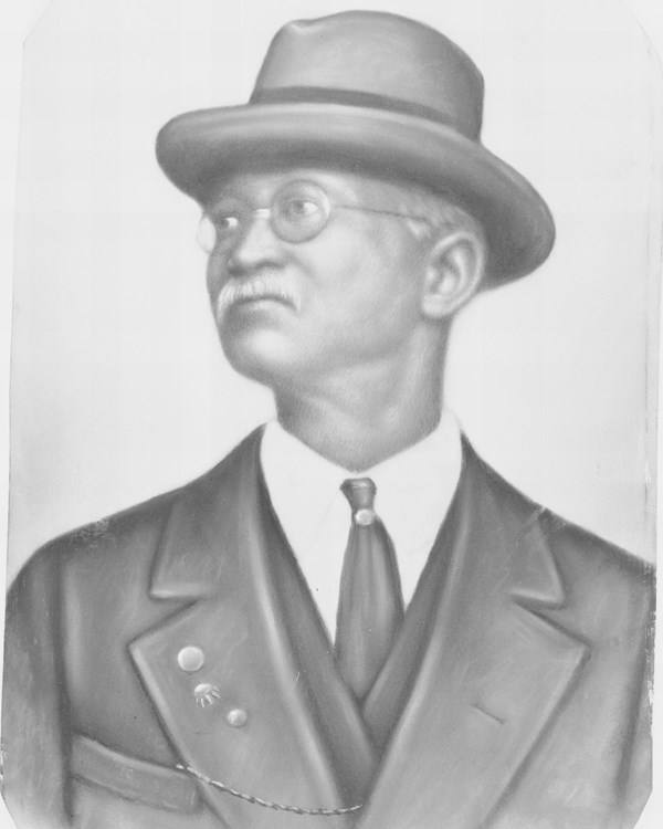 portrait of older man in a suit and hat
