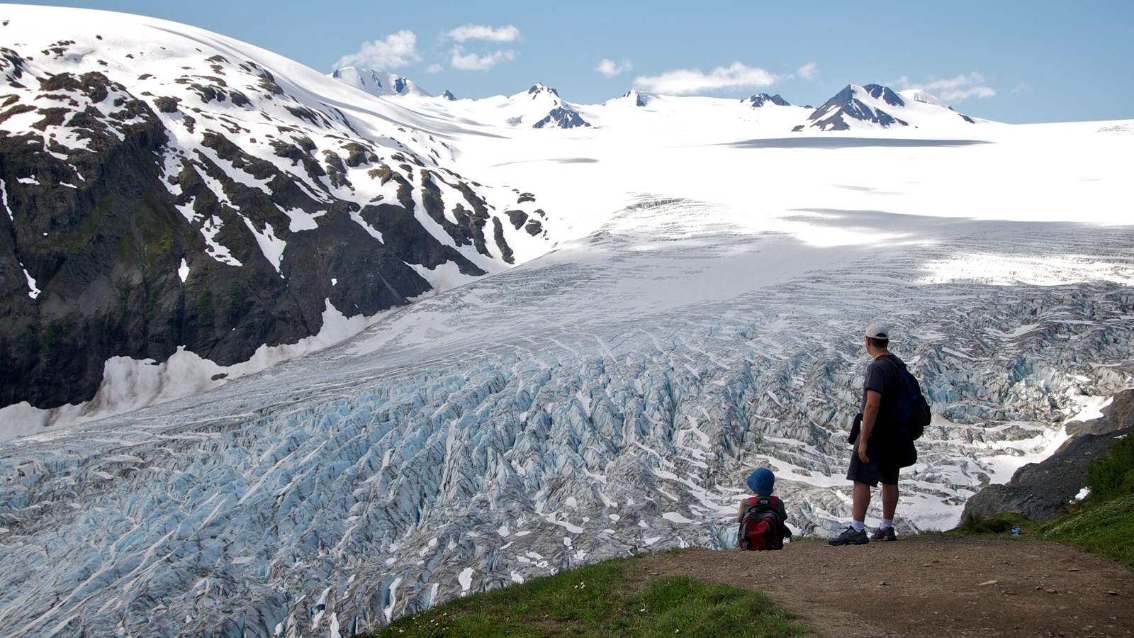 Father and son viewing the Harding Icefield from Top of the Cliffs along the Harding Icefield Trail.