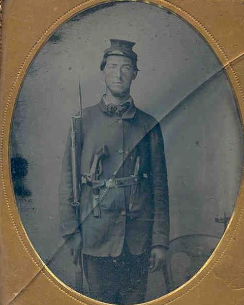 Soldier in Union uniform posing for photo. 