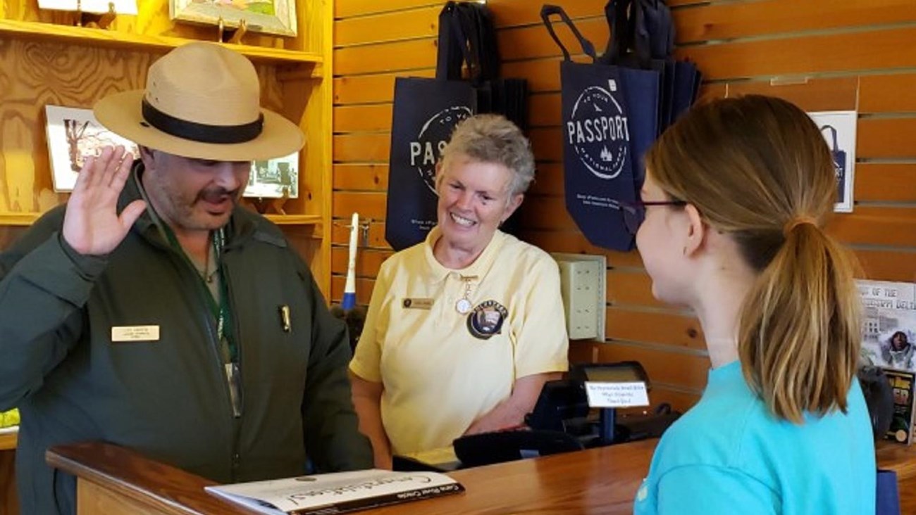 A Park Ranger leads a new Junior Ranger in the Junior Ranger Oath