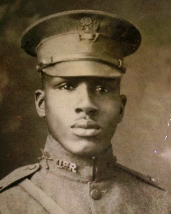 Black and white photo of African American man in WW1 military uniform