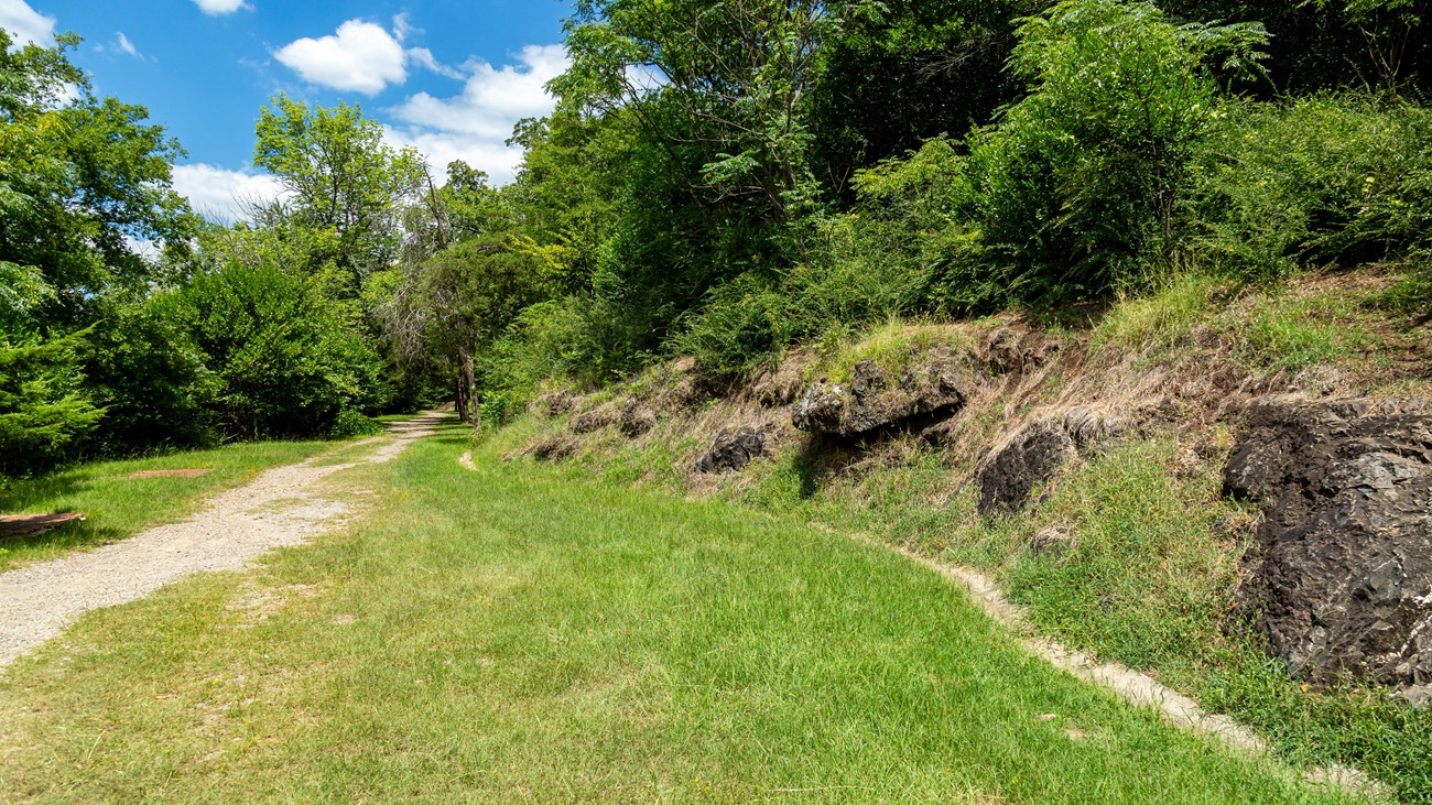 Gravel paths converge on the grass.