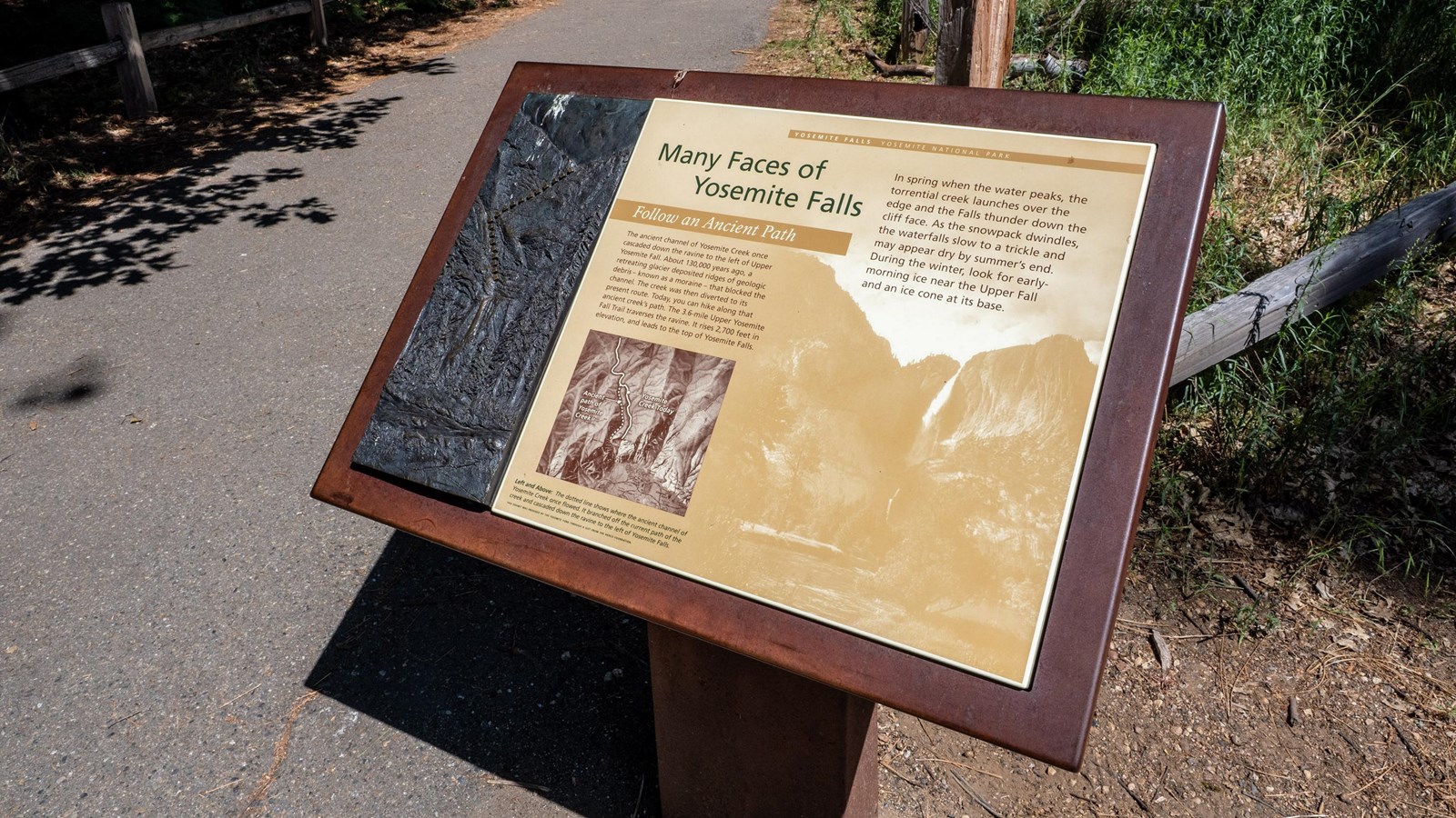 A wayside exhibit with a bronze tactile quarter panel
