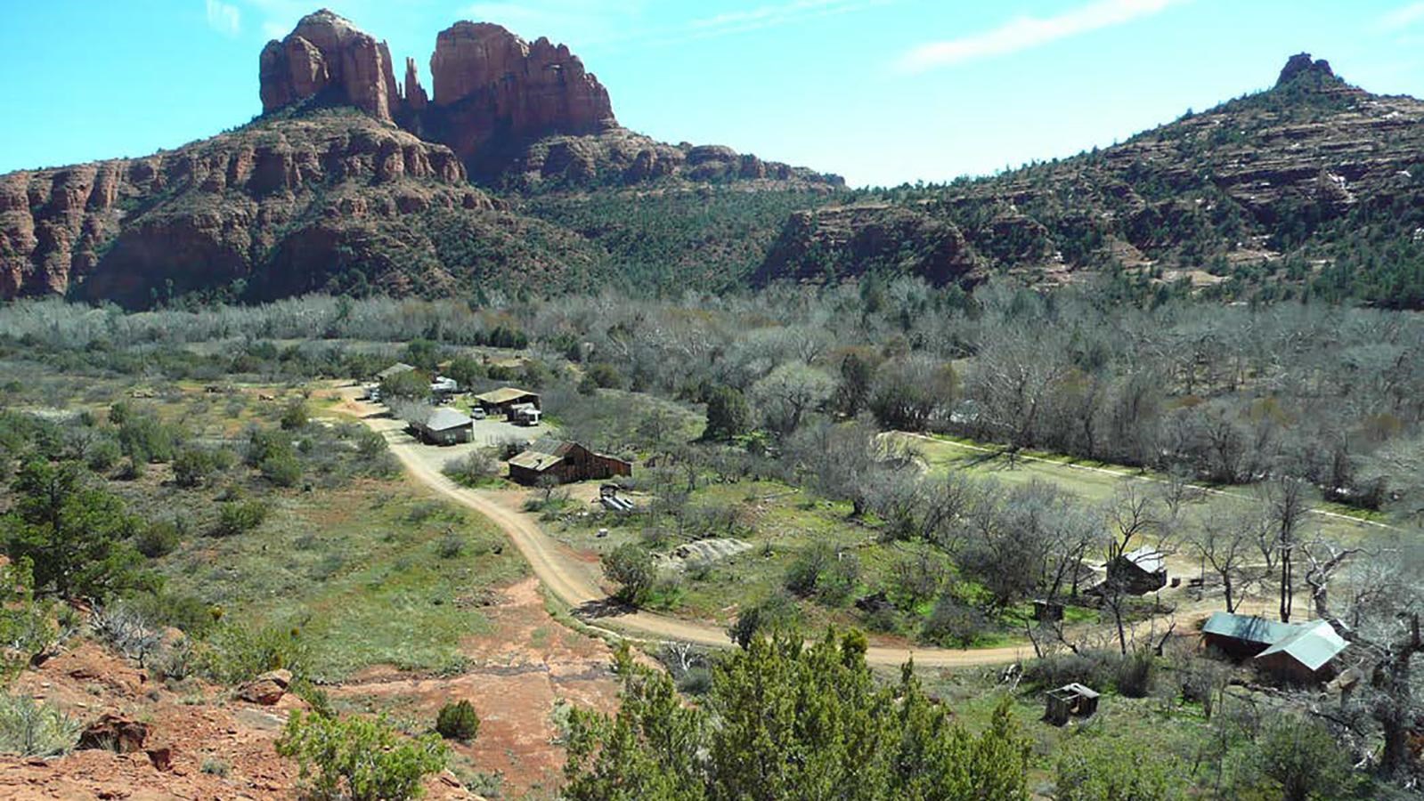 Overview of OK Ranch Historic District showing several buildings and large rock outcroppings in the 