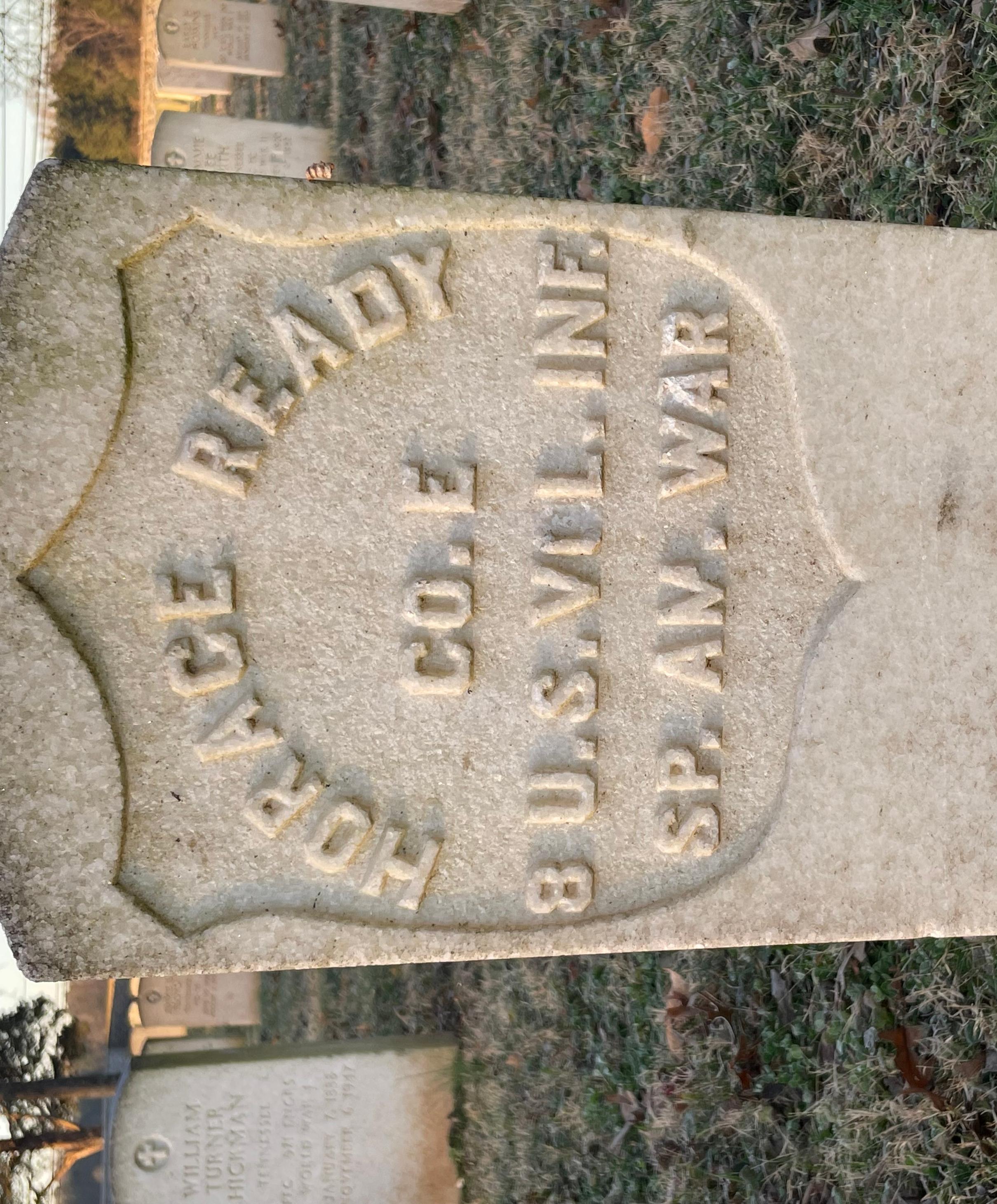 A white marble headstone marking the burial plot of Horace Ready.
