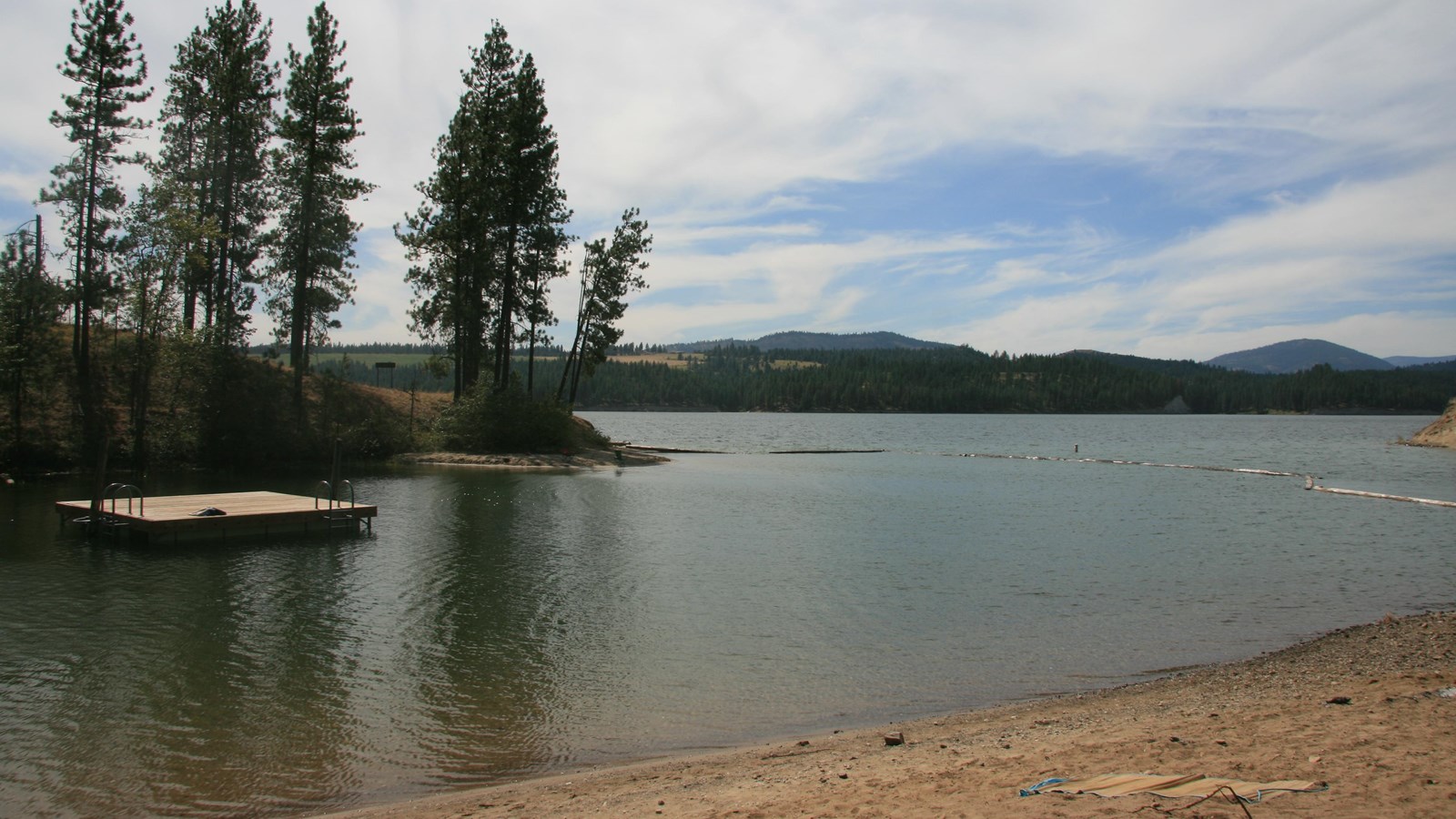 A small swim beach looking to the lake beyond.