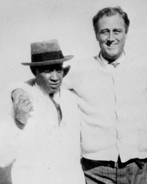 Leroy Jones standing next to Franklin Roosevelt.
