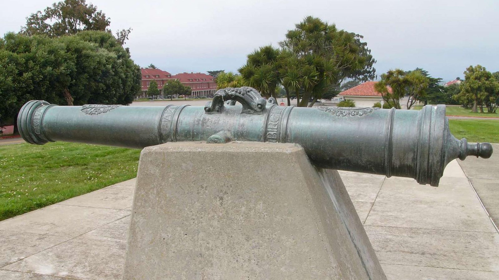 Bronze cannon with Presidio buildings in background La Birgen de Barbaneda