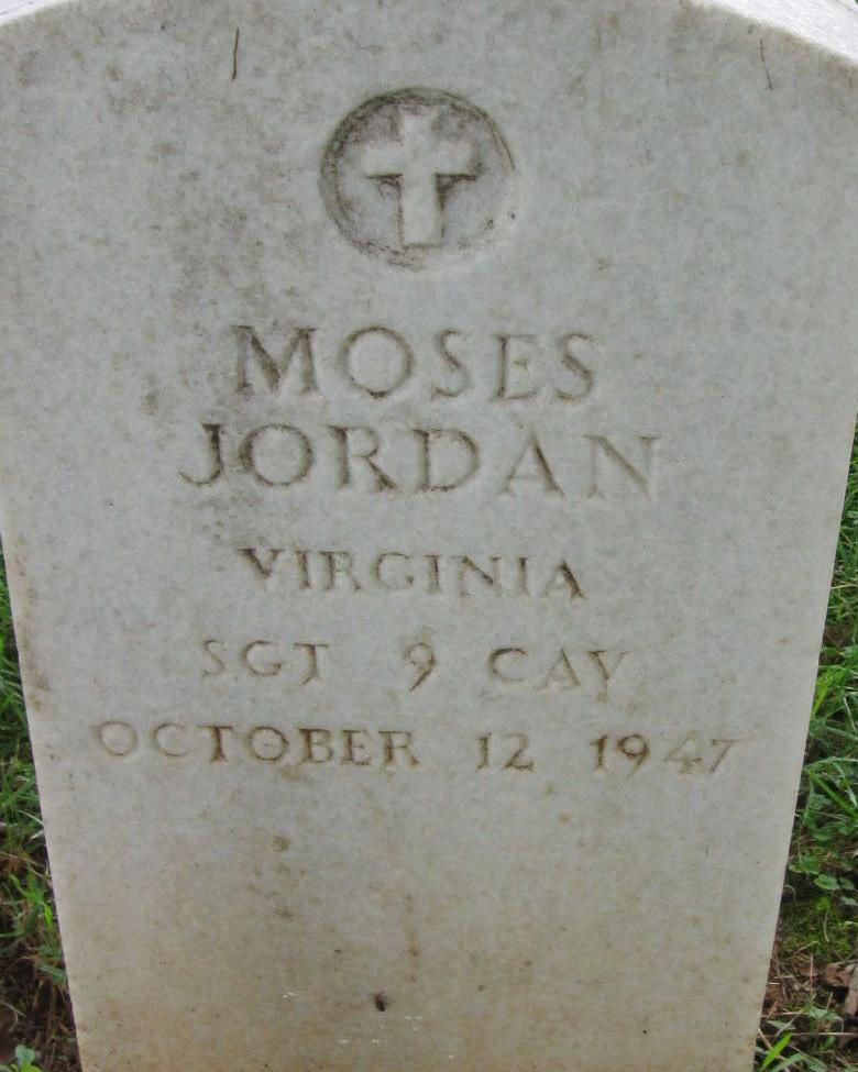 White marble headstones marking the burial ploy of Moses Jordan.