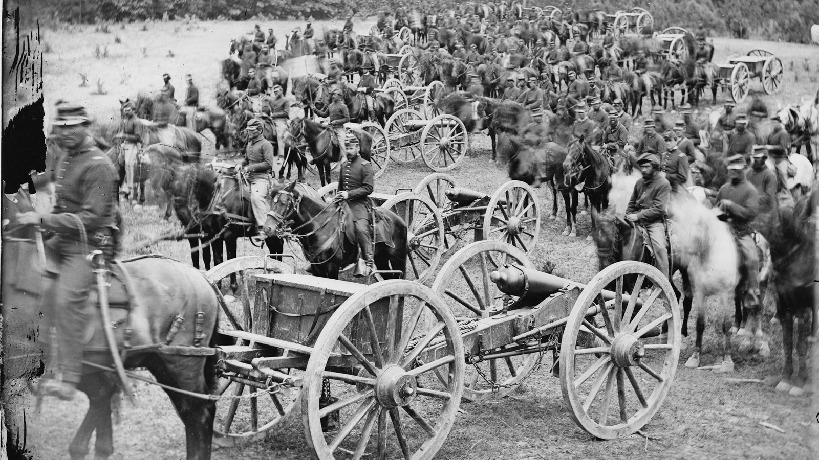 A Black and White photograph on Union artillery with Cannons and Horses