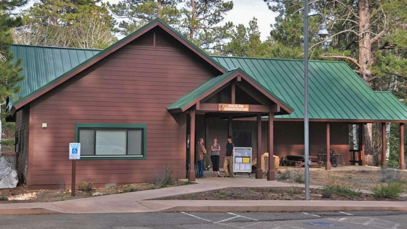 A brown building with a green roof