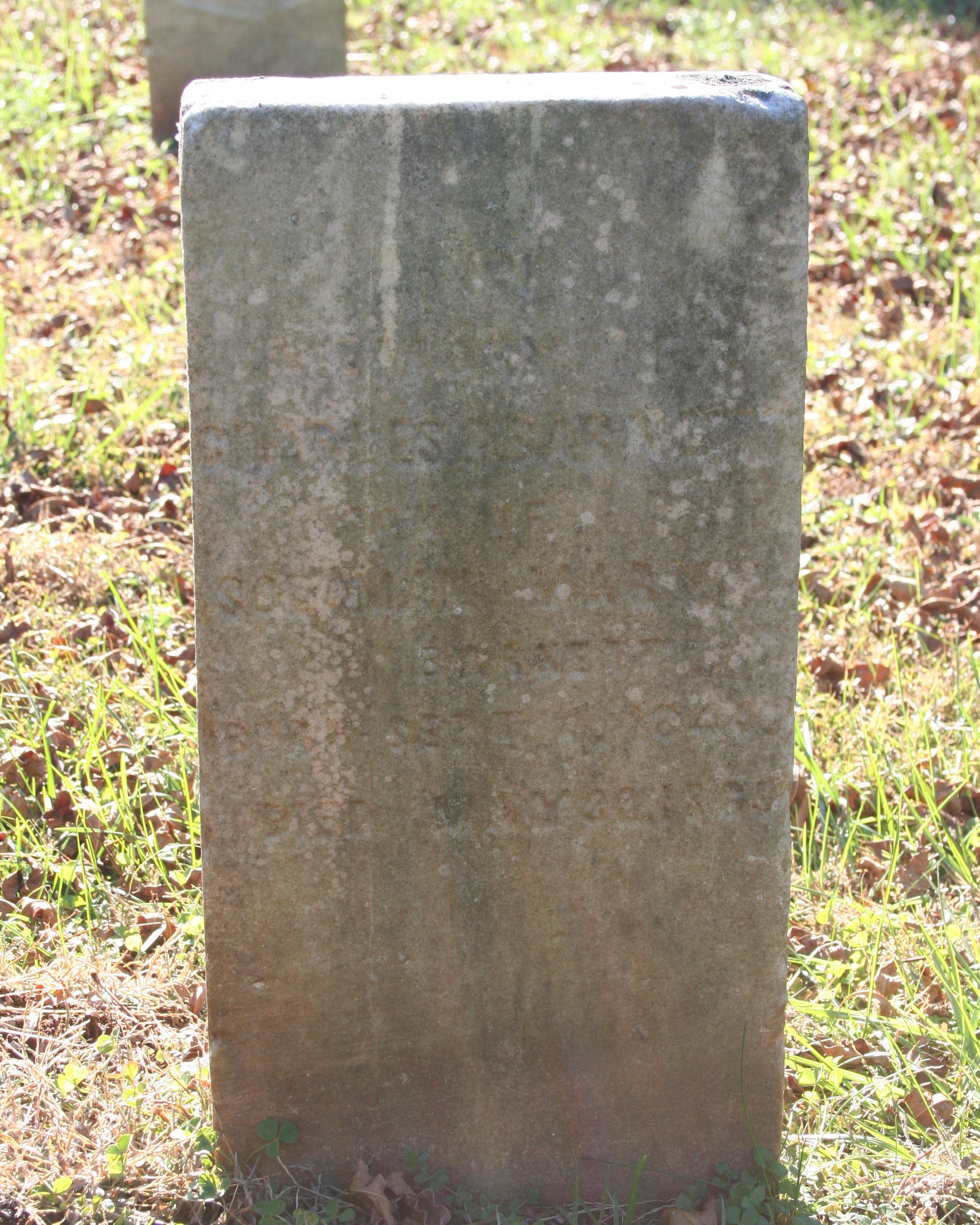 Simple marble headstone belonging to Charles Barnett of the 143rd Indiana Infantry.