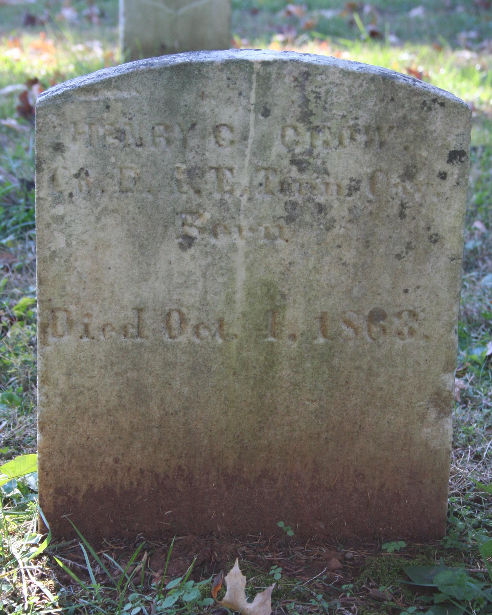 Short marble headstone with rounded shape. 