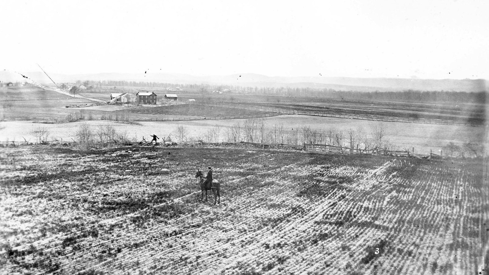 A black and white photograph of Cemetery Ridge