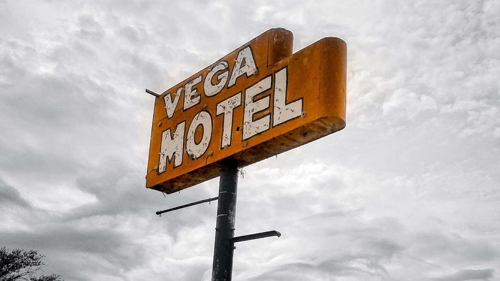 A red sign with white text reads