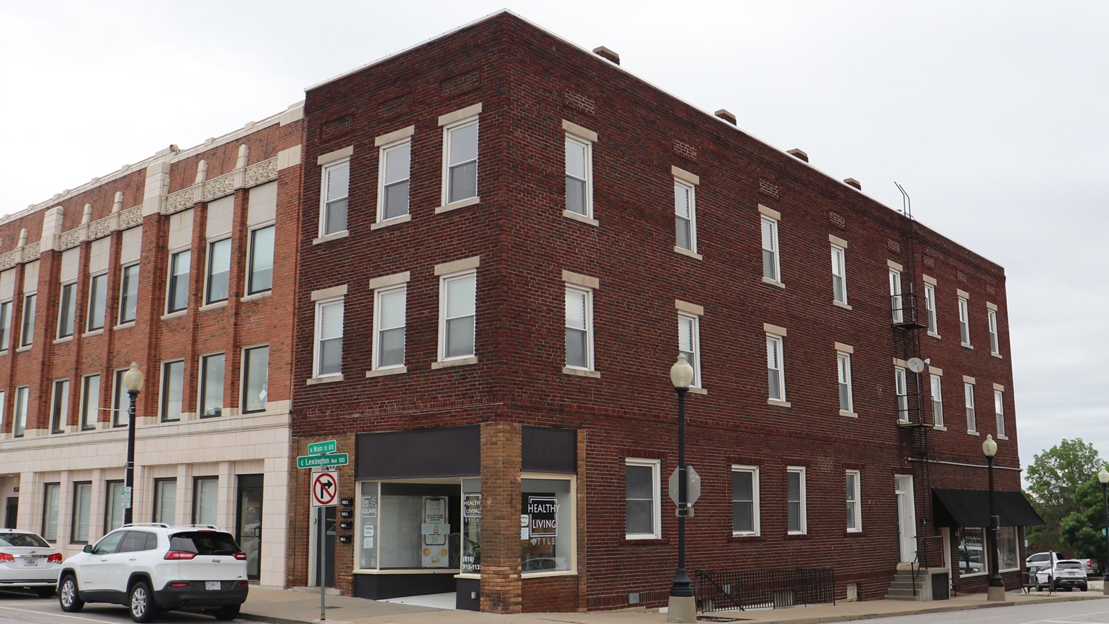 A three-story brick building on the corner of the historic Independence square.
