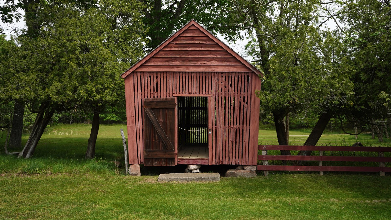A mid-sized building with slated walls.