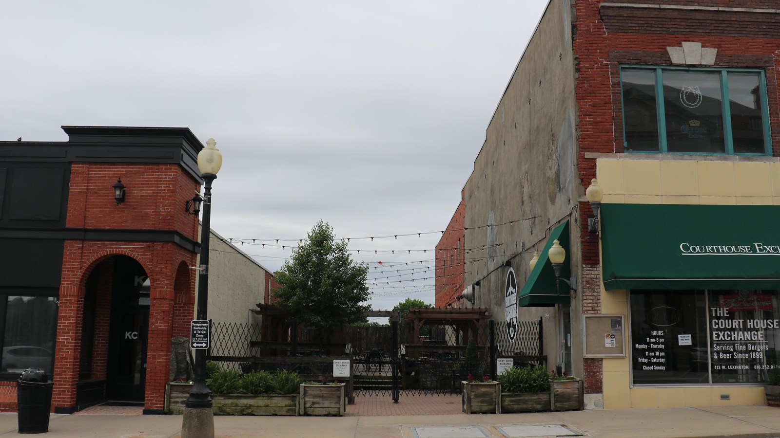 There is an empty space between two brick buildings on the historic Independence square.