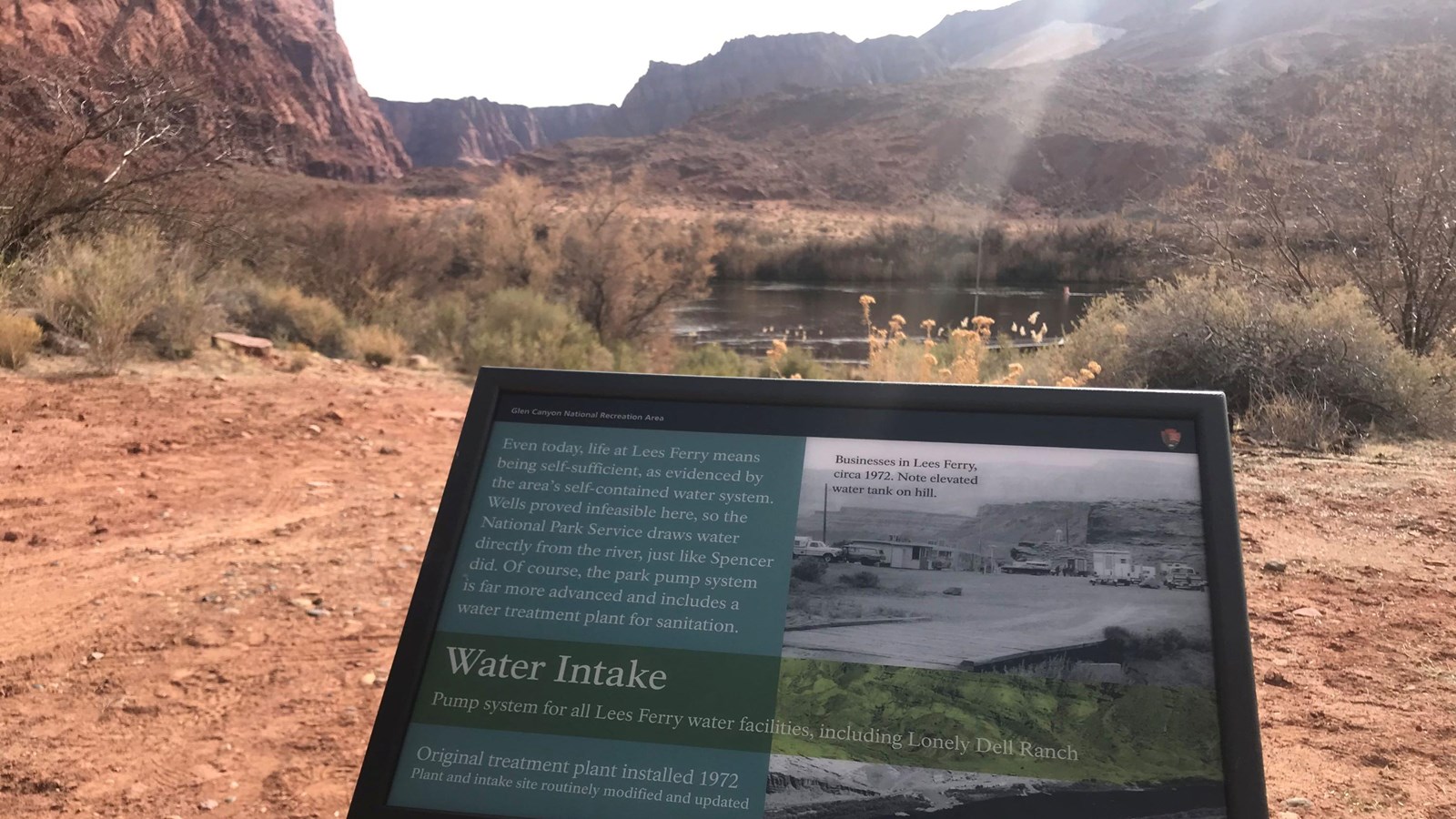 Interpretive sing overlooking Colorado River explaining water intake systems of Lee Ferry