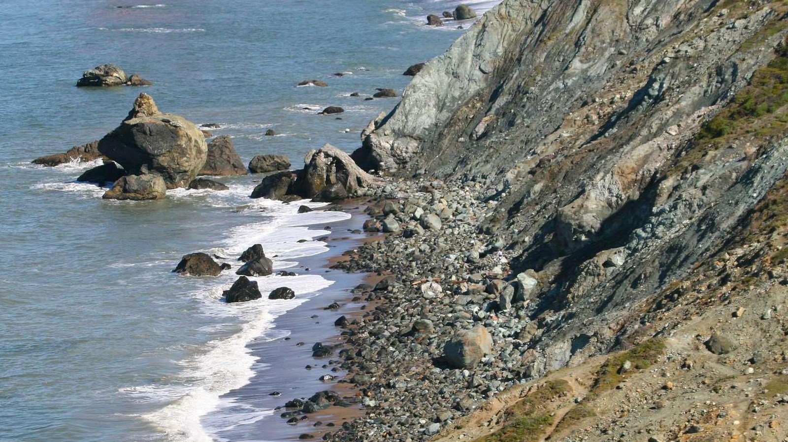 The blue-green serpentinite coastal bluffs. 