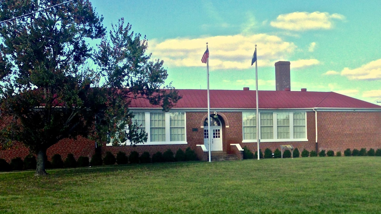Photo of s one-story school. 