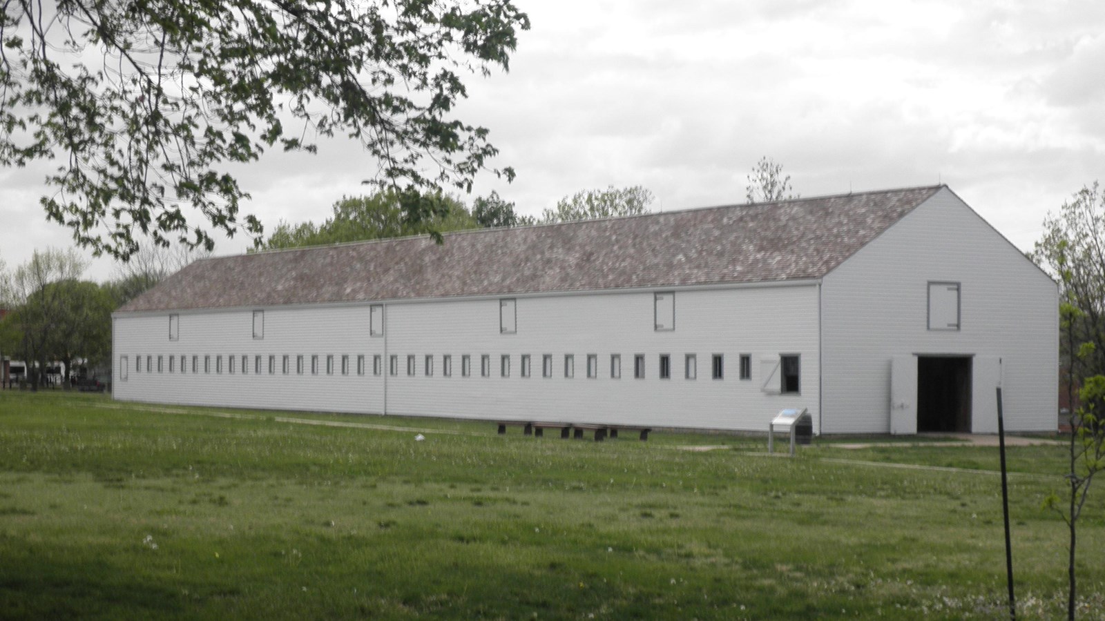 Long white building with several windows