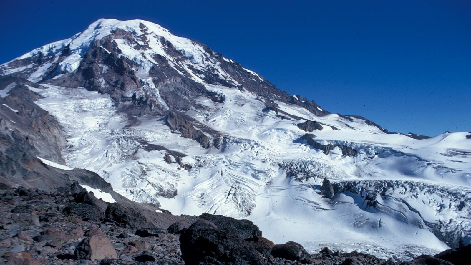 Large glacier on rocky, heavily glaciated mountain
