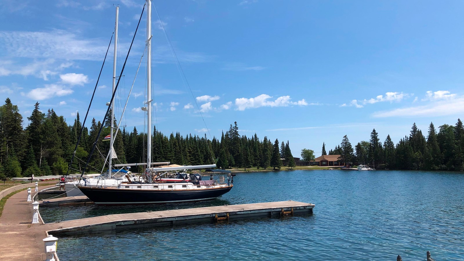 Two sailboats docked at the Rock Harbor Marina. 