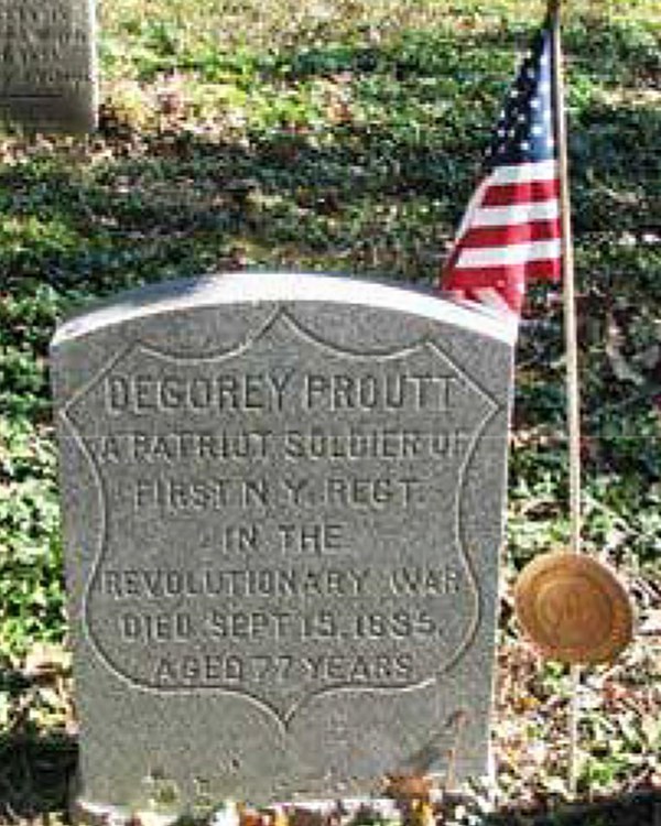 A smallish headstone with the name "Degory Proutt" in large letters at the top.