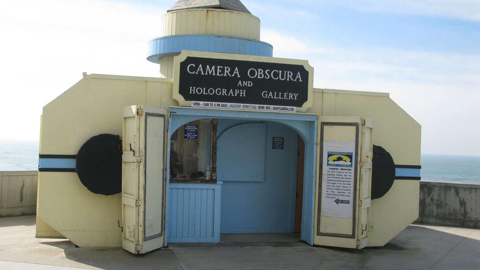 Outside the small, rectangular building that houses the Camera Obscura behind the Cliff House.